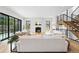 Bright living room featuring a fireplace, hardwood floors, and a staircase at 200 Magnolia St, Denver, CO 80220