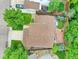 Aerial view of the home highlighting the roof, landscaping, and outdoor patio at 8838 S Dudley St, Littleton, CO 80128