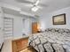 Cozy bedroom with a ceiling fan, neutral walls, and a classic patterned rug at 8838 S Dudley St, Littleton, CO 80128