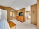 A spacious main bedroom suite with neutral carpet, a TV and ensuite bathroom at 8838 S Dudley St, Littleton, CO 80128
