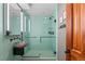 Modern bathroom featuring a glass shower, stylish fixtures, and a unique vessel sink at 12653 Rancho Ct, Conifer, CO 80433