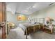 Cozy bedroom with neutral tones, carpet flooring, and a comfortable bed at 12653 Rancho Ct, Conifer, CO 80433