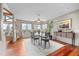 Dining room with large windows and a table set for six, with views of the outside landscape at 12653 Rancho Ct, Conifer, CO 80433