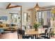 Dining room featuring mountain views, designer light fixture and hardwood floors at 12653 Rancho Ct, Conifer, CO 80433
