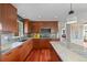 Modern kitchen featuring custom cabinets, stone countertops, and stainless steel appliances at 12653 Rancho Ct, Conifer, CO 80433