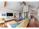Living room showcasing the open layout, modern fireplace, hardwood flooring, and stylish decor at 12653 Rancho Ct, Conifer, CO 80433