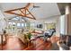 Open concept living room with expansive windows, hardwood floors, and vaulted ceilings at 12653 Rancho Ct, Conifer, CO 80433