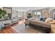 Spacious main bedroom with wood floors, a seating area, and access to a balcony with views at 12653 Rancho Ct, Conifer, CO 80433