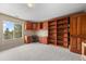 Dedicated office space with custom wood built-ins, providing a functional and stylish workspace at 12653 Rancho Ct, Conifer, CO 80433