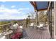 Inviting outdoor deck features wicker seating and stunning panoramic mountain views for peaceful relaxation at 12653 Rancho Ct, Conifer, CO 80433