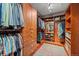Spacious walk-in closet with custom wood cabinetry, shelving, and drawers for ample storage and organization at 12653 Rancho Ct, Conifer, CO 80433