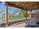 View of the backyard featuring a stone patio with access to stairs and lush greenery at 9977 Falcon Creek Dr, Highlands Ranch, CO 80130