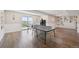 Spacious finished basement featuring wood floors, recessed lighting and a ping pong table at 9977 Falcon Creek Dr, Highlands Ranch, CO 80130