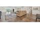 Finished basement area with a large sofa, wood-look floors, and ample space for entertainment at 9977 Falcon Creek Dr, Highlands Ranch, CO 80130