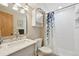 Bathroom showcasing a vanity with a marble countertop, shower, and subway tiles at 9977 Falcon Creek Dr, Highlands Ranch, CO 80130