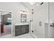 Bright bathroom featuring a glass shower, modern vanity, and a skylight that fills the room with natural light at 9977 Falcon Creek Dr, Highlands Ranch, CO 80130