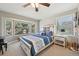 Cozy bedroom with a large bay window, comfortable bed, and charming decor at 9977 Falcon Creek Dr, Highlands Ranch, CO 80130