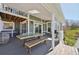 Covered deck with outdoor seating and a grill, perfect for entertaining guests at 9977 Falcon Creek Dr, Highlands Ranch, CO 80130
