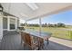 Covered deck with outdoor seating perfect for enjoying views of the vast green space at 9977 Falcon Creek Dr, Highlands Ranch, CO 80130