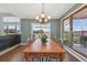 Bright dining room featuring a wooden table, large windows, and hardwood floors at 9977 Falcon Creek Dr, Highlands Ranch, CO 80130