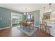 Dining area featuring a wooden table, chairs, and access to the outdoor deck at 9977 Falcon Creek Dr, Highlands Ranch, CO 80130