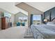 Spacious main bedroom featuring vaulted ceilings, a view, and a sitting area at 9977 Falcon Creek Dr, Highlands Ranch, CO 80130