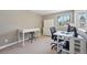 Bright home office space with natural light, dual desks, and comfortable seating at 9977 Falcon Creek Dr, Highlands Ranch, CO 80130
