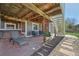 Relaxing outdoor space with stone patio, stairs, and comfortable seating at 9977 Falcon Creek Dr, Highlands Ranch, CO 80130