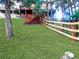 Expansive backyard with a wooden fence and a view of the house with a deck at 29983 Hilltop Dr # 2, Evergreen, CO 80439