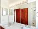 Bathroom with double sinks, large mirror, closet, and walk-in shower provides ample space and functionality at 29983 Hilltop Dr # 2, Evergreen, CO 80439
