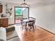 Inviting dining area with a wooden table set and sliding glass doors leading to a balcony at 29983 Hilltop Dr # 2, Evergreen, CO 80439
