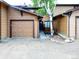 Charming home exterior with attached garage and inviting front entrance framed by a lovely birch tree at 29983 Hilltop Dr # 2, Evergreen, CO 80439