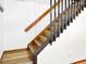 Staircase with gray risers and wooden steps leading to upper level, showcasing modern design at 29983 Hilltop Dr # 2, Evergreen, CO 80439