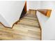 Stairway with wooden steps and light-colored floor and handrail provides access to different levels of the home at 29983 Hilltop Dr # 2, Evergreen, CO 80439