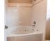 A relaxing soaking tub is featured in this bathroom with tile surround at 468 English Sparrow Trl, Highlands Ranch, CO 80129