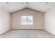 A bedroom with neutral carpet, a window, and a high vaulted ceiling at 468 English Sparrow Trl, Highlands Ranch, CO 80129