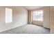 Cozy bedroom with neutral walls, soft carpet, and large windows offering natural light at 468 English Sparrow Trl, Highlands Ranch, CO 80129