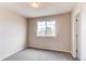 Bright bedroom with neutral paint, carpet and a window at 468 English Sparrow Trl, Highlands Ranch, CO 80129