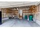 Spacious garage with built-in shelves for ample storage and easy organization of tools and equipment at 468 English Sparrow Trl, Highlands Ranch, CO 80129