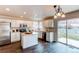 Modern kitchen with stainless steel appliances, white cabinetry, and center island at 468 English Sparrow Trl, Highlands Ranch, CO 80129