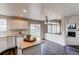 Bright kitchen with ample counter space and seamless flow to the outdoor patio and living area at 468 English Sparrow Trl, Highlands Ranch, CO 80129