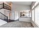 Living room showcasing open layout, staircase, and seamless transition to the kitchen at 468 English Sparrow Trl, Highlands Ranch, CO 80129