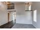 Spacious living area featuring an open floor plan, wood floors, and a staircase at 468 English Sparrow Trl, Highlands Ranch, CO 80129