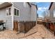 Well maintained home side yard and fence with gravel walking path, a serene and private outdoor space at 468 English Sparrow Trl, Highlands Ranch, CO 80129