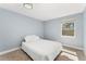 Bright bedroom featuring a neutral color scheme and a large window at 5031 Upton Ct, Denver, CO 80239