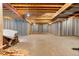 Unfinished basement with high ceilings and ample space for future development at 590 Cumberland Rd, Larkspur, CO 80118