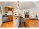 Basement wet bar with wine rack and seating at 590 Cumberland Rd, Larkspur, CO 80118