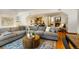 Finished basement with sectional sofa and fireplace at 590 Cumberland Rd, Larkspur, CO 80118