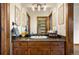 Bathroom with granite vanity and updated fixtures at 590 Cumberland Rd, Larkspur, CO 80118
