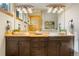 Bathroom with double vanity and large mirror at 590 Cumberland Rd, Larkspur, CO 80118